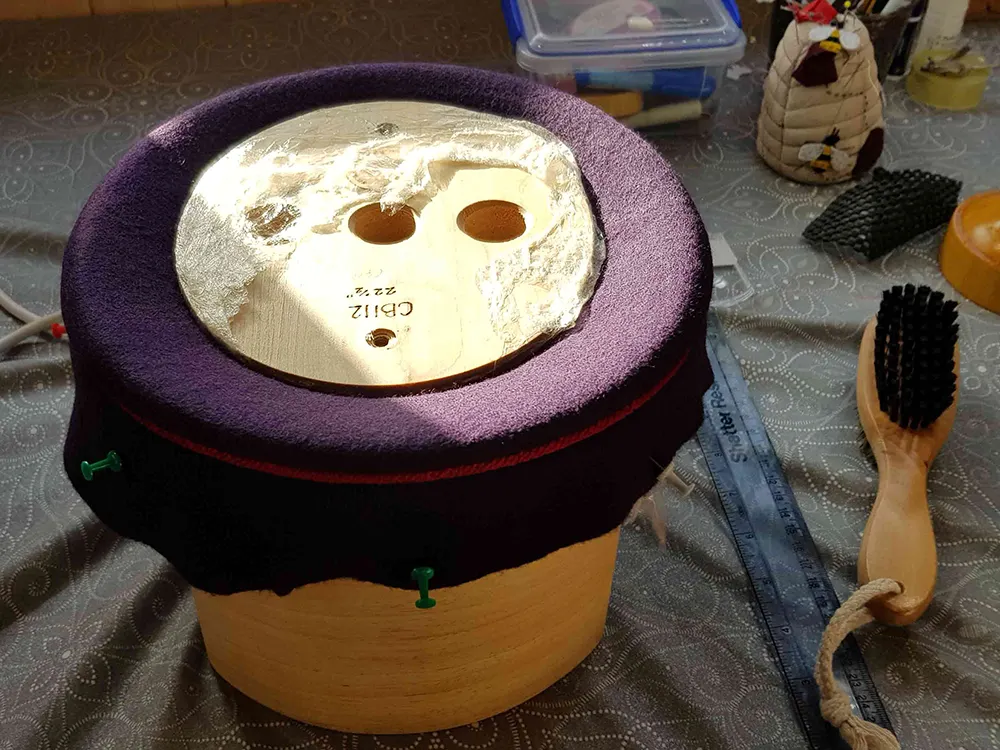 purple felt in a hat block.