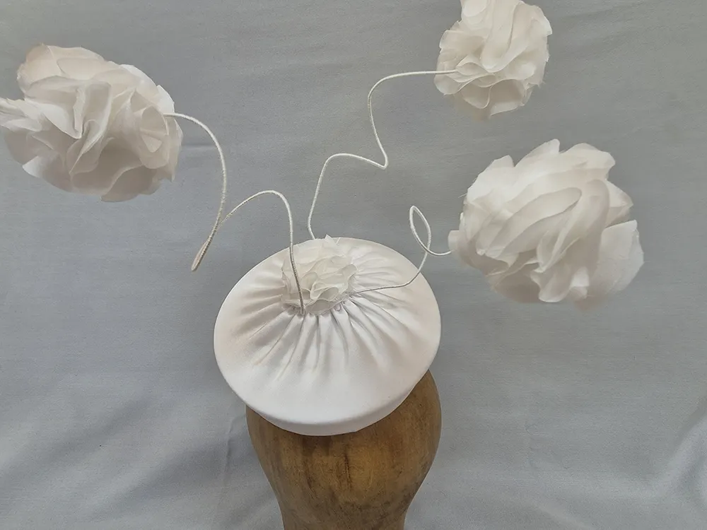 Bridal hat with three Pompoms.