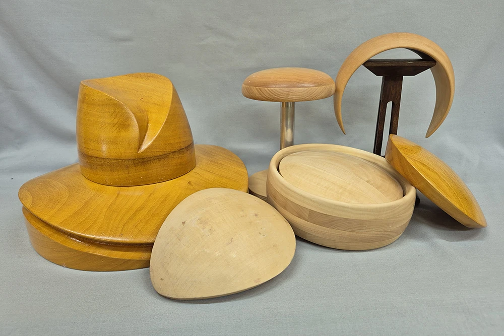 a selection of wooden hat blocks