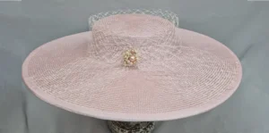 Pink and cream wide-brimmed hat.